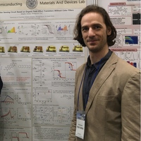 Tarsoly Gergely in front of a poster